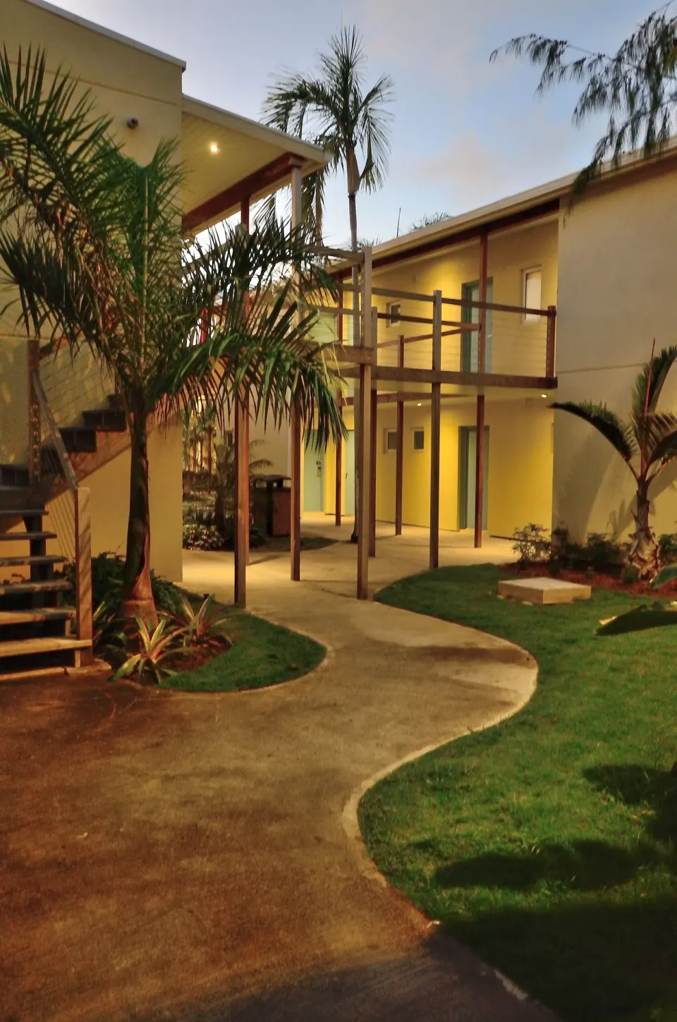 Evening courtyard walkway and exterior stairs at Royal St. Kitts Hotel.