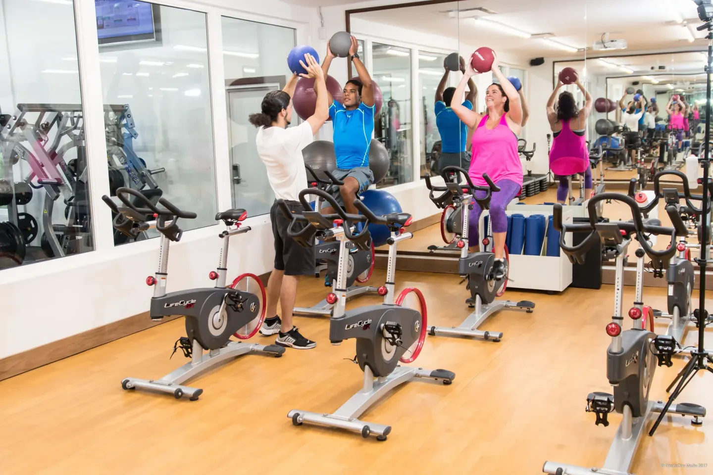 Group cycling class using medicine balls at Royal St. Kitts Hotel.