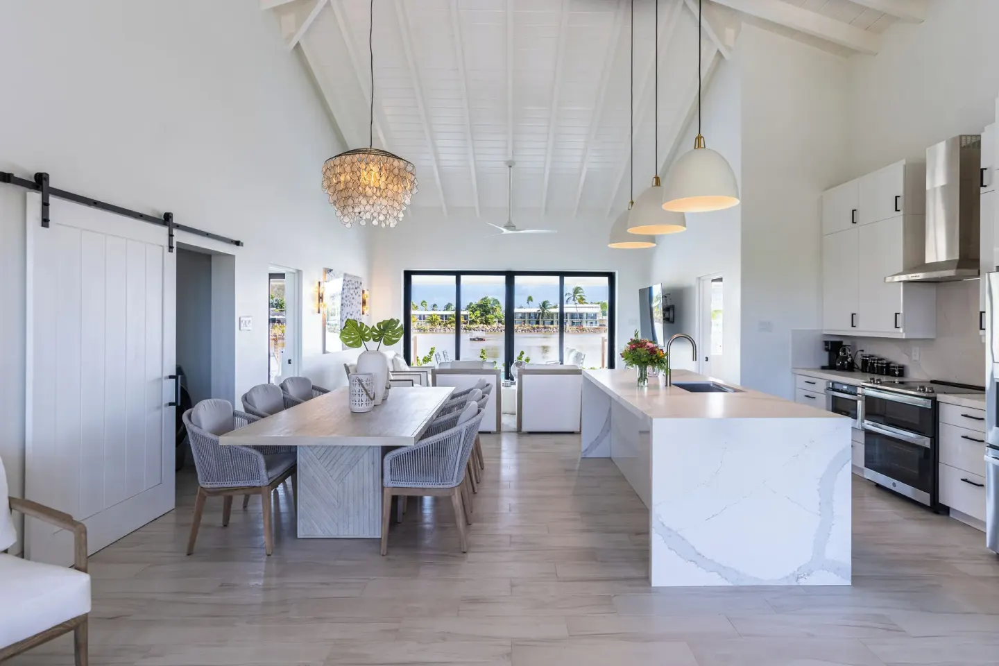 Open kitchen and dining area with high ceiling at Royal St. Kitts Hotel.