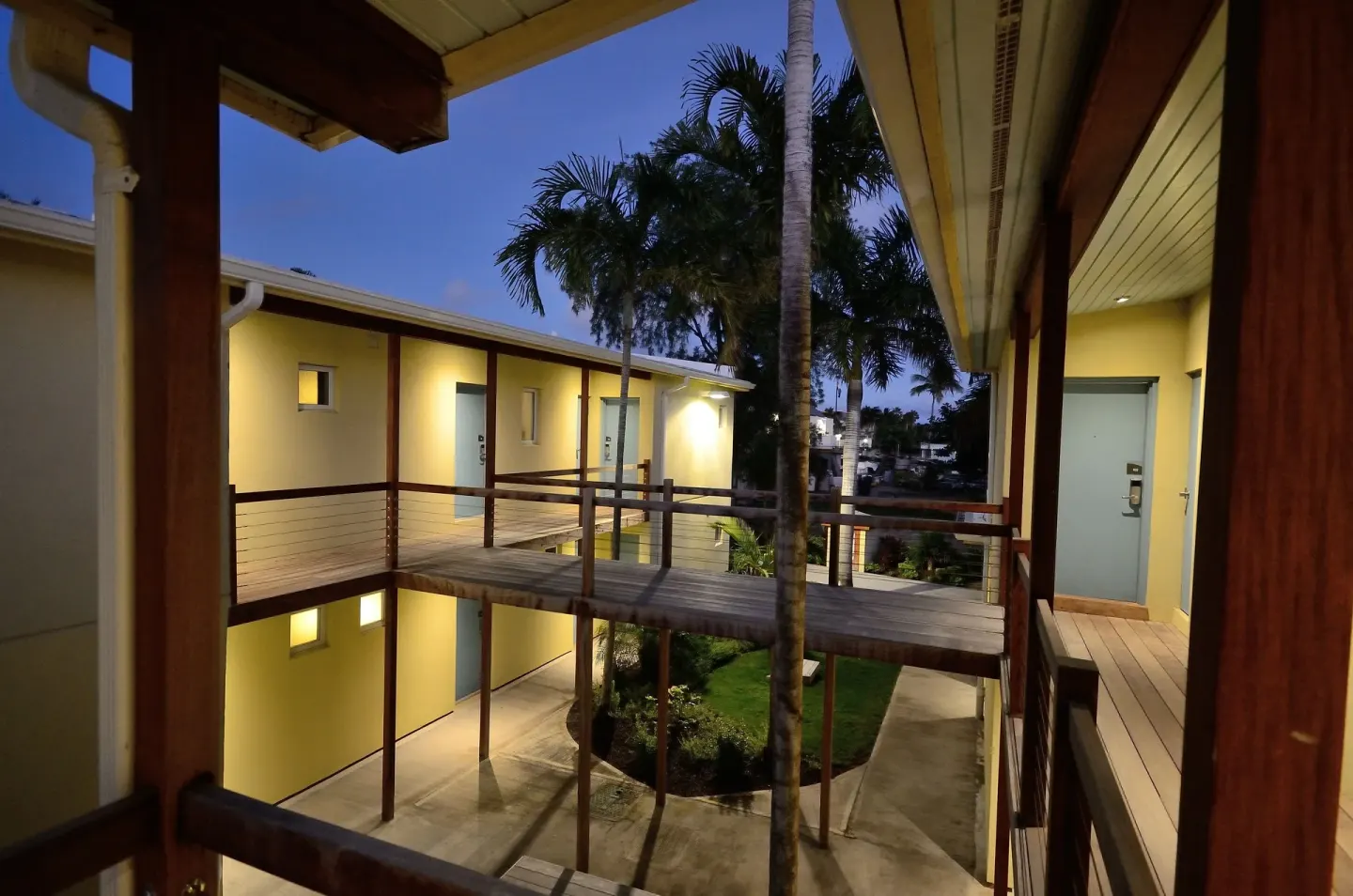 Exterior walkways outside Deluxe Studio Rooms at Royal St. Kitts Hotel at dusk.