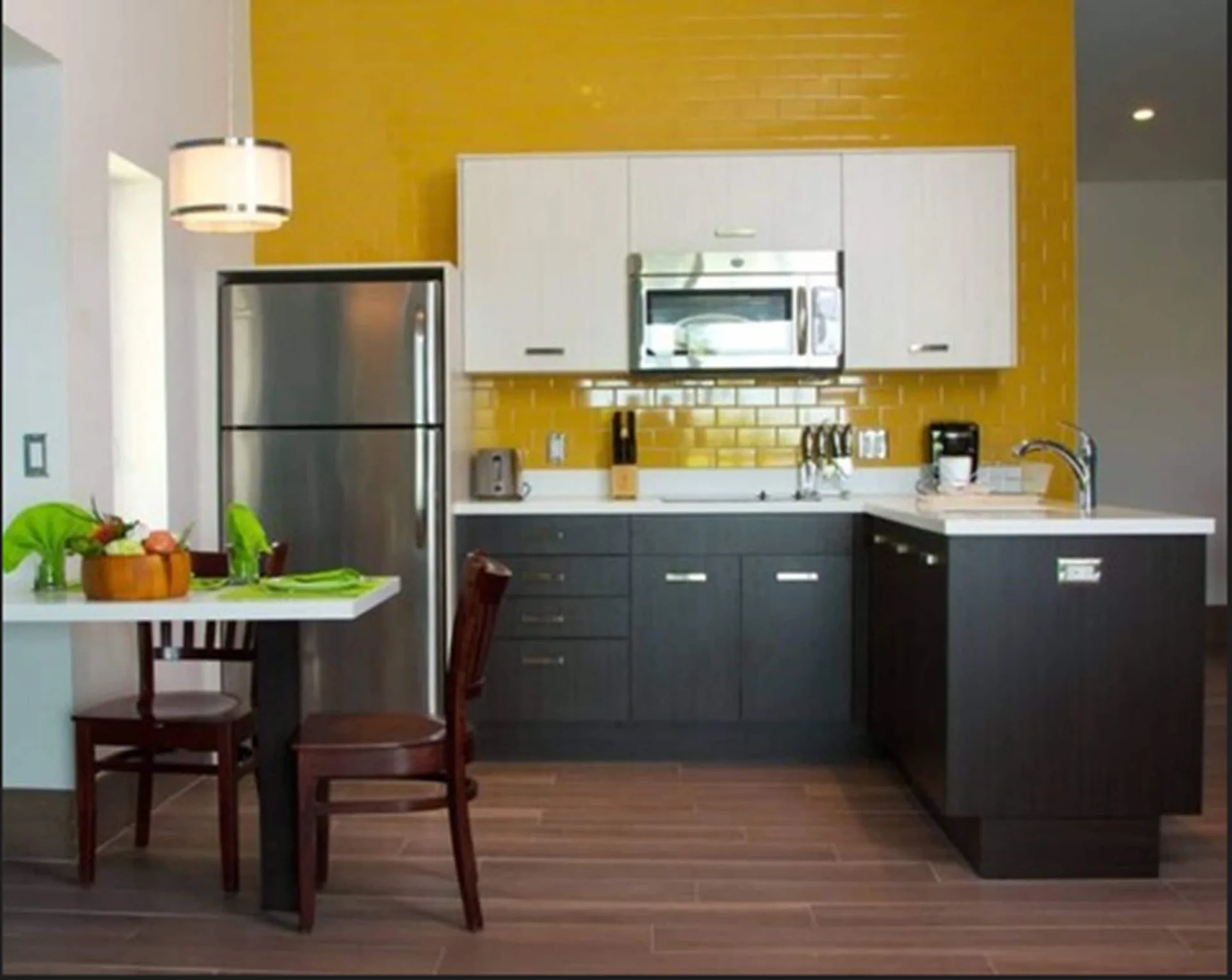 Deluxe Studio Room kitchenette and dining table at Royal St. Kitts Hotel.