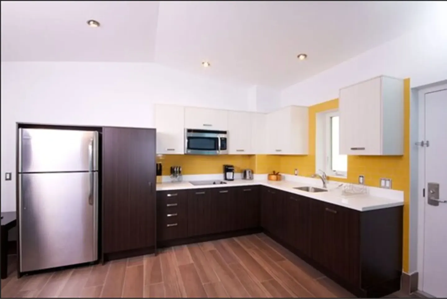 Premium Apartment 1 Bedroom kitchen with full-size refrigerator at Royal St. Kitts Hotel.