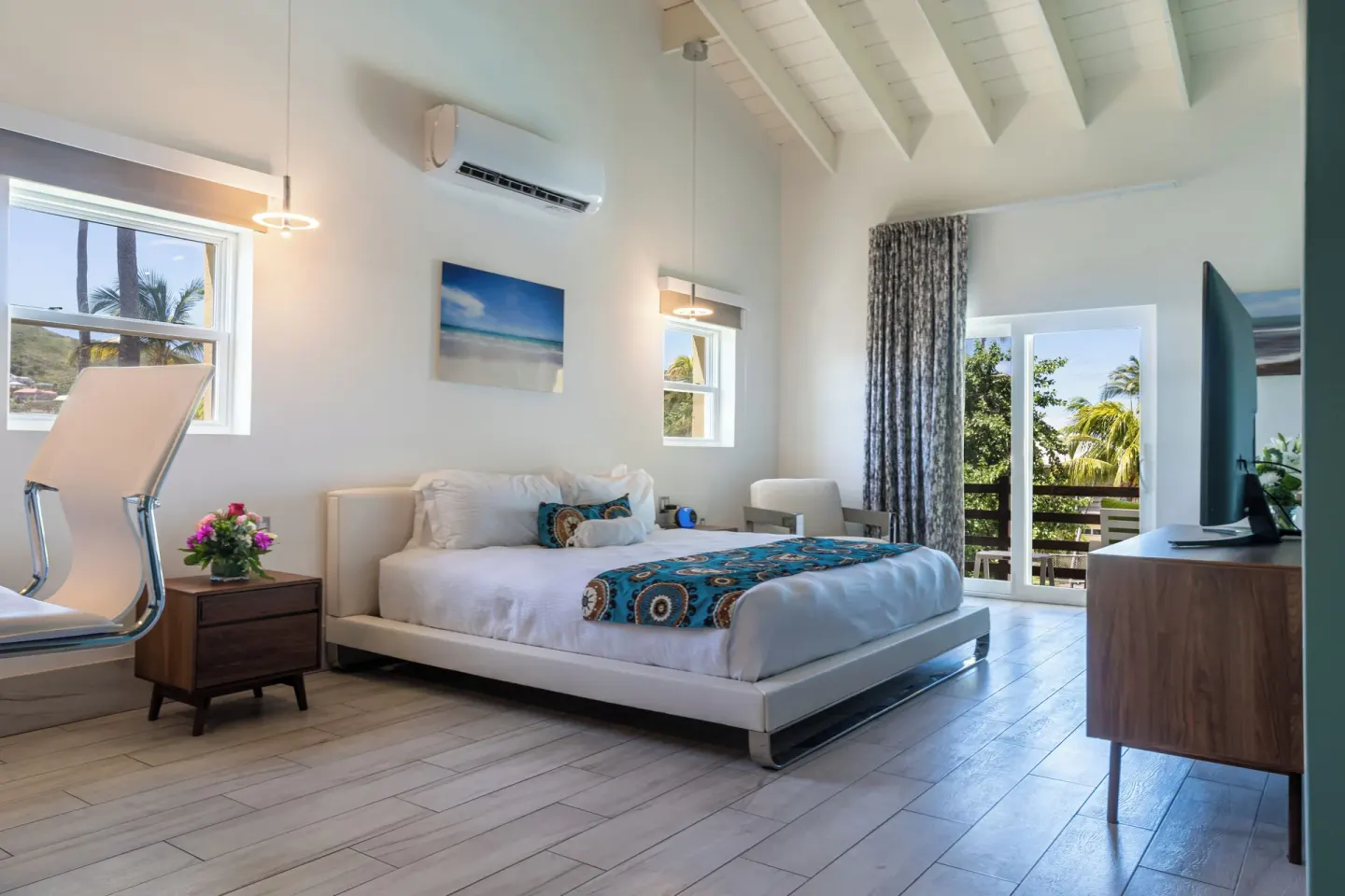 Superior Studio Poolside king bed with balcony doors at Royal St. Kitts Hotel.