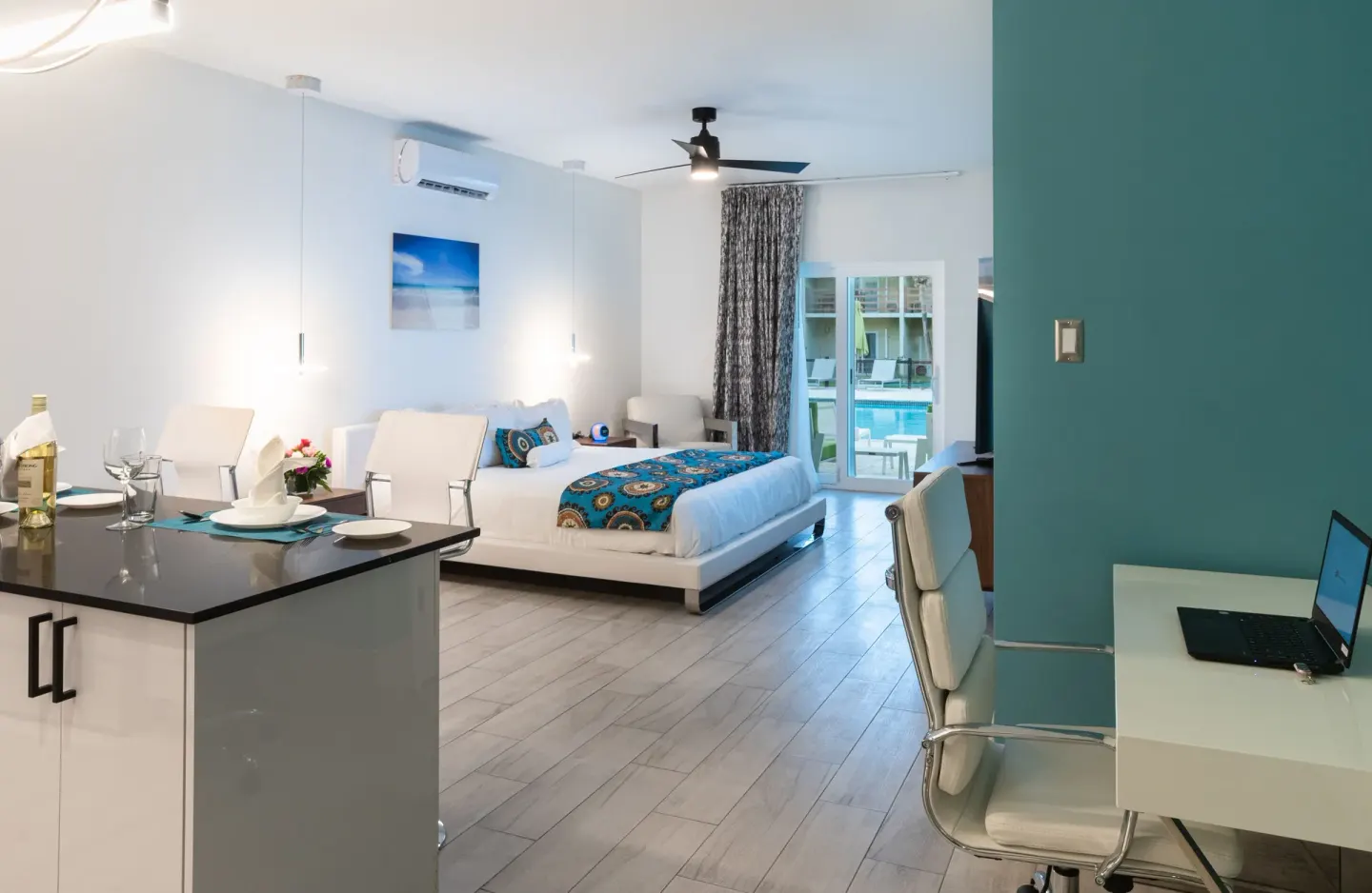 Superior Studio Poolside king bed, kitchenette and desk at Royal St. Kitts Hotel.