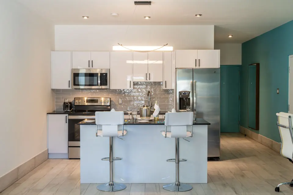 Superior Studio Poolside kitchen with island seating at Royal St. Kitts Hotel.