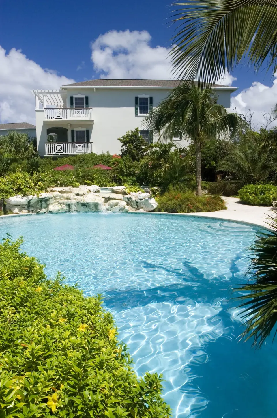 Lagoon-style pool with palms and resort balconies at Royal West Indies Resort.