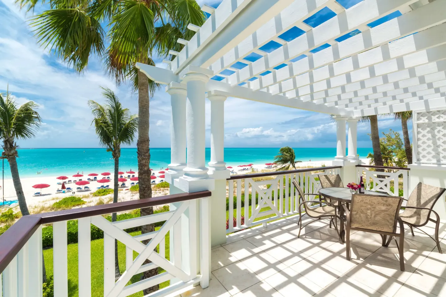 Spacious balcony with pergola and ocean view at Royal West Indies Resort.