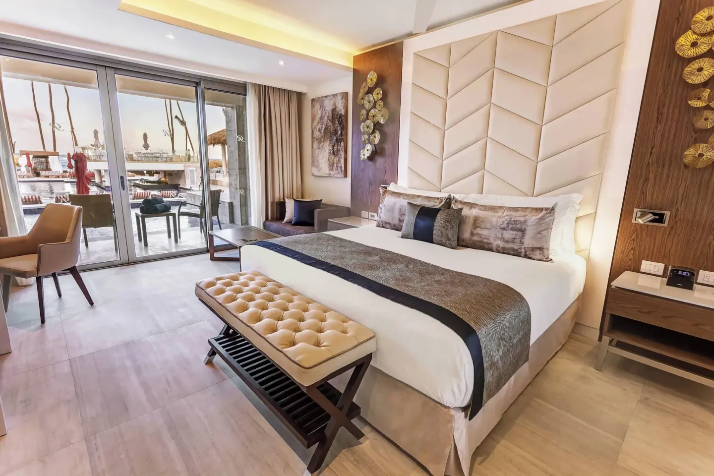 Guest room with king bed and terrace by the pool at Royalton Bavaro Resort & Casino.