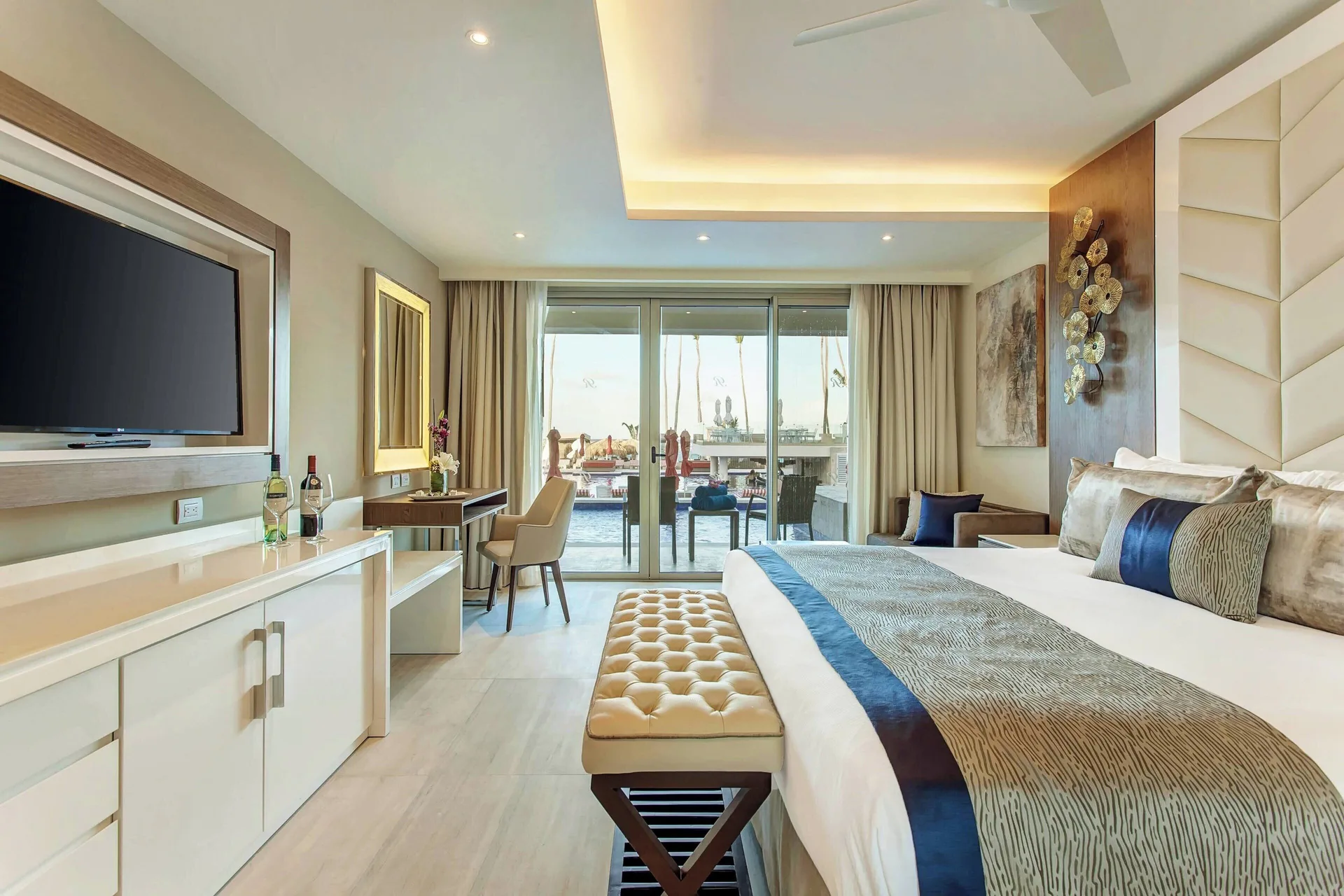 King bed guest room with swim-out terrace at Royalton Bavaro Resort & Casino.