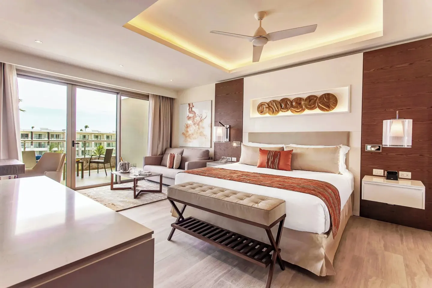 King bed suite with balcony seating at Royalton Bavaro Resort & Casino.