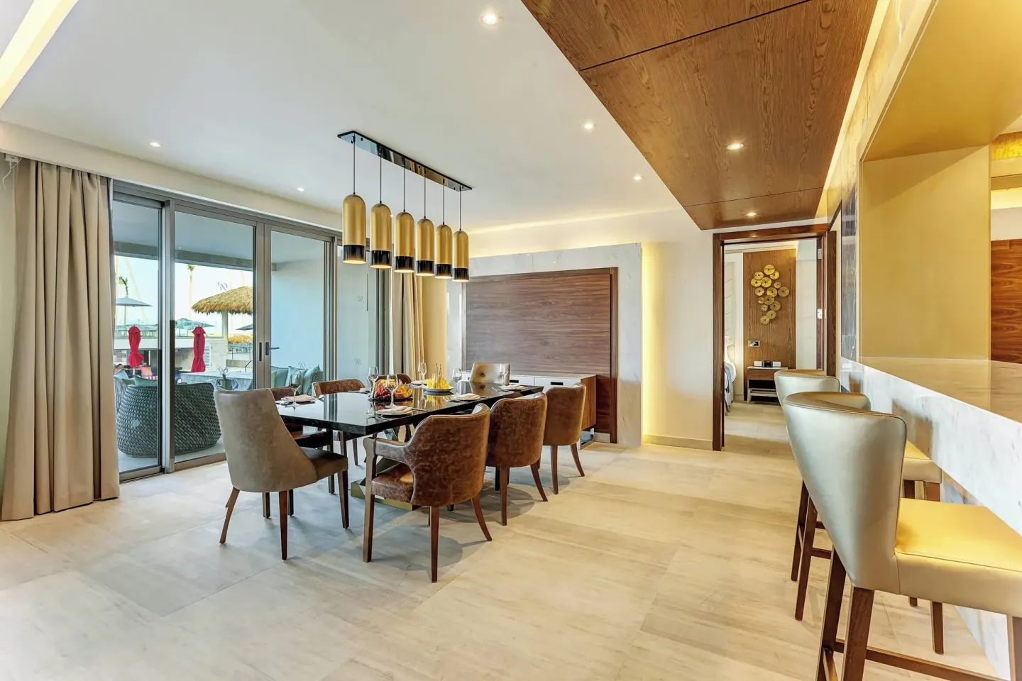 Suite dining area with terrace doors at Royalton Bavaro Resort & Casino.