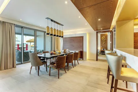 Suite dining area with terrace doors at Royalton Bavaro Resort & Casino.