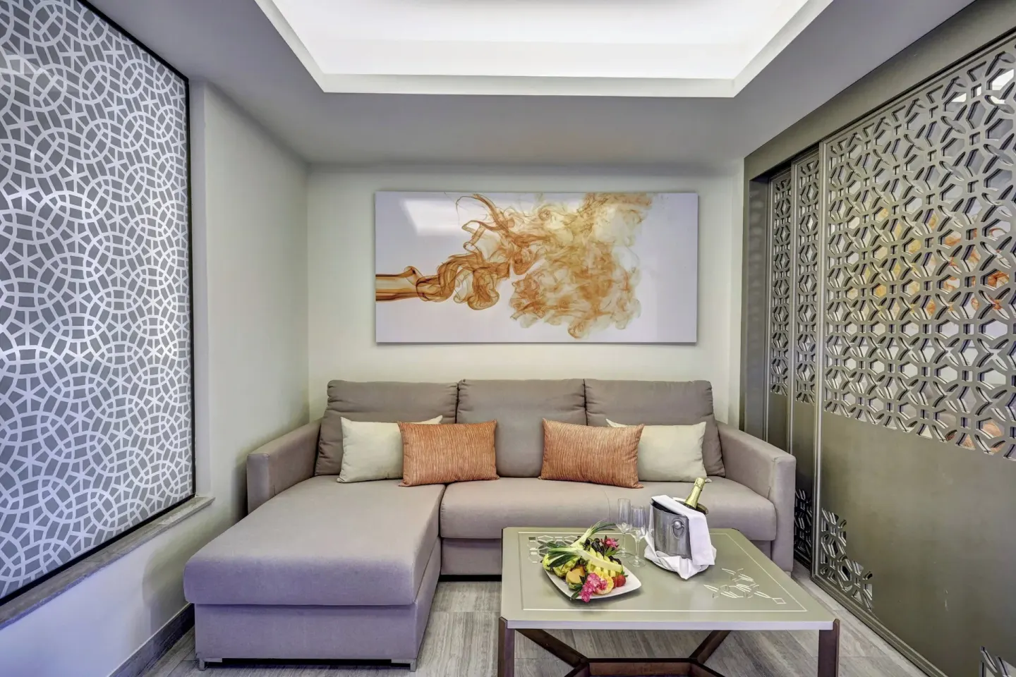 Suite sitting area with sectional sofa at Royalton Bavaro Resort & Casino.