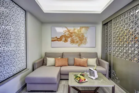 Suite sitting area with sectional sofa at Royalton Bavaro Resort & Casino.