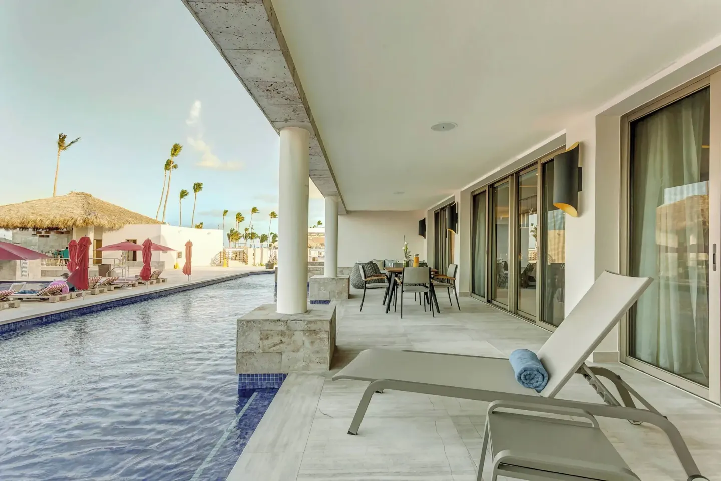 Swim-out patio with lounger and pool access at Royalton Bavaro Resort & Casino.