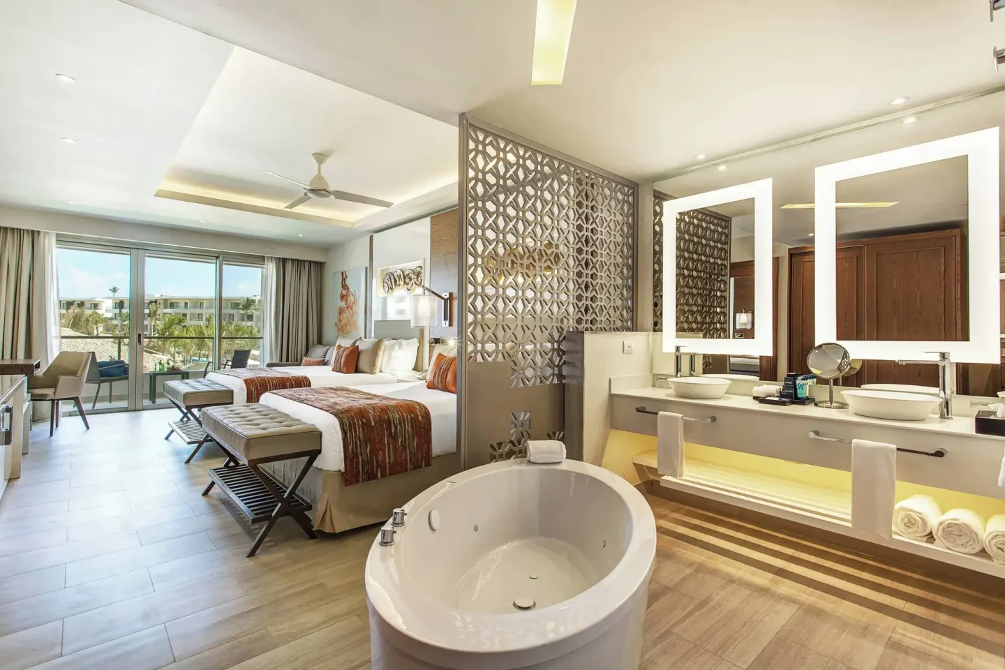 Two queen beds and open bath area at Royalton Bavaro Resort & Casino.