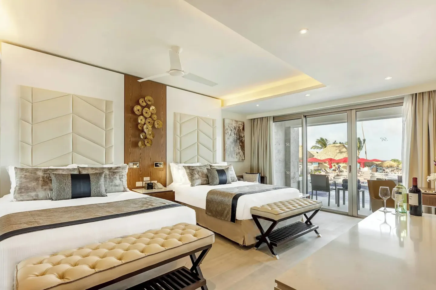 Two queen beds with beach-facing terrace at Royalton Bavaro Resort & Casino.