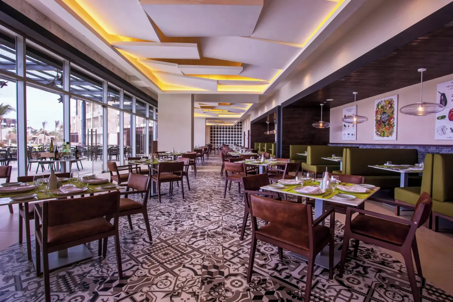 Modern dining room with patterned tile floor at Royalton Bavaro Resort & Casino.