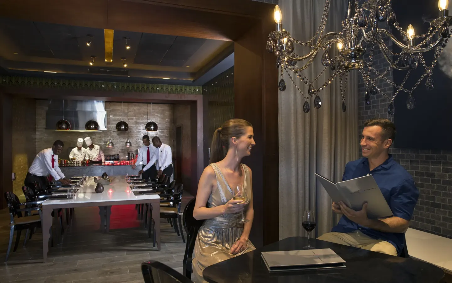 Teppanyaki dining area at Royalton Bavaro Resort & Casino with guests seated near a show kitchen.