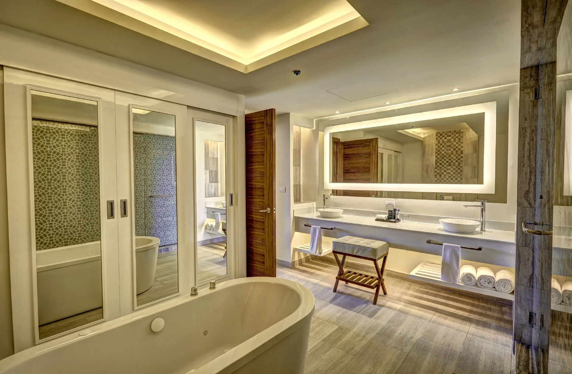 Suite bathroom with soaking tub and double vanity at Royalton Bavaro Resort & Casino.