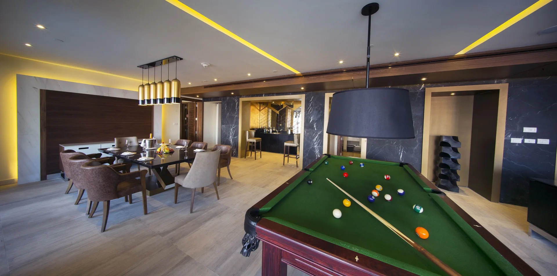 Billiards table beside the dining area in the Chairman Suite at Royalton Bavaro Resort & Casino.