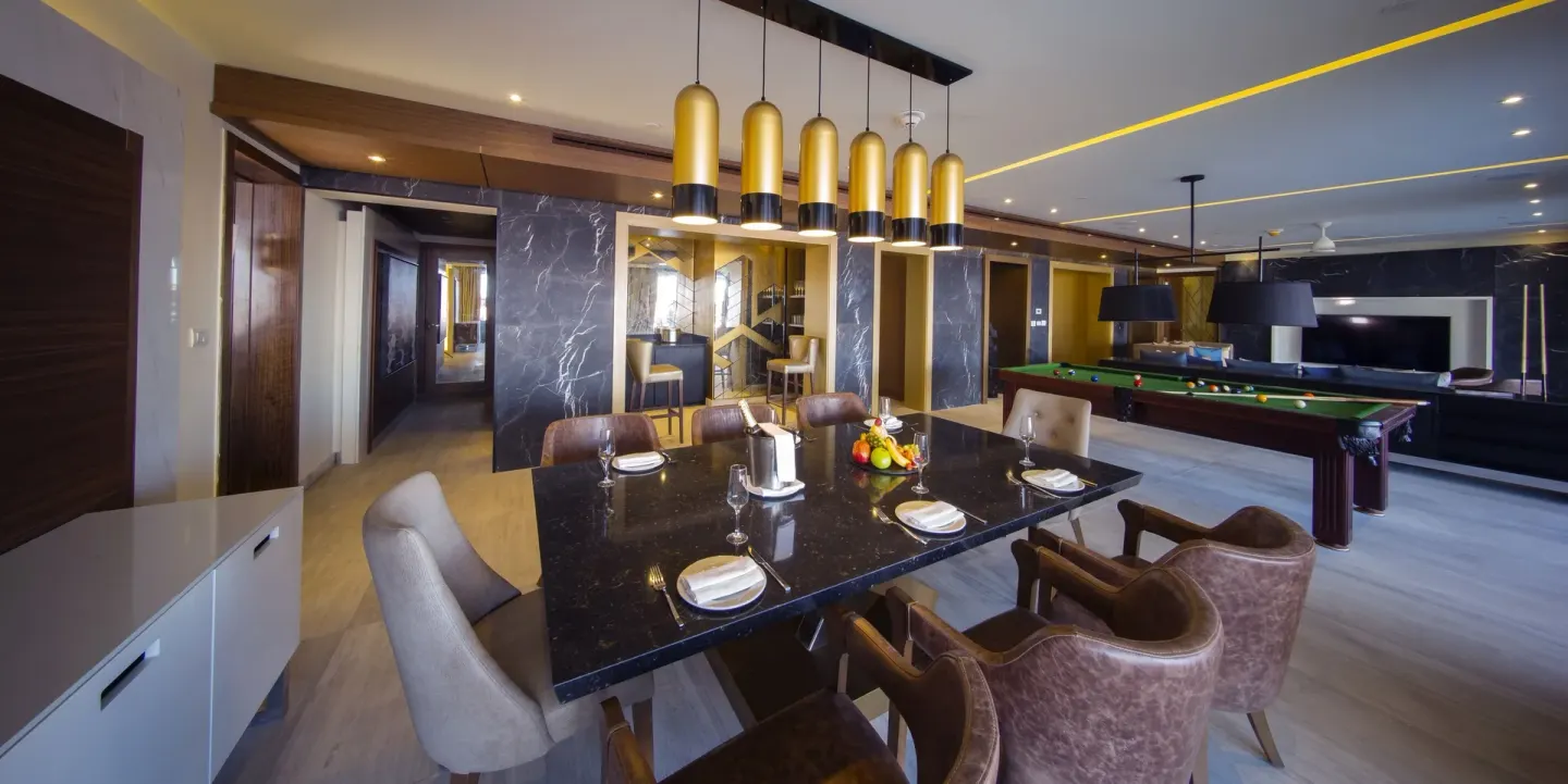 Dining table and billiards area in the Chairman Suite at Royalton Bavaro Resort & Casino.