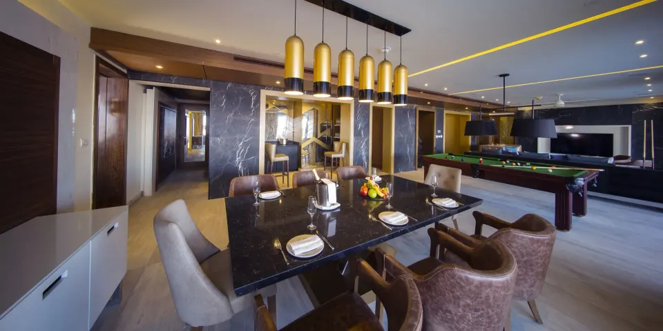 Dining area and billiards table in a two bedroom suite at Royalton Bavaro Resort & Casino.