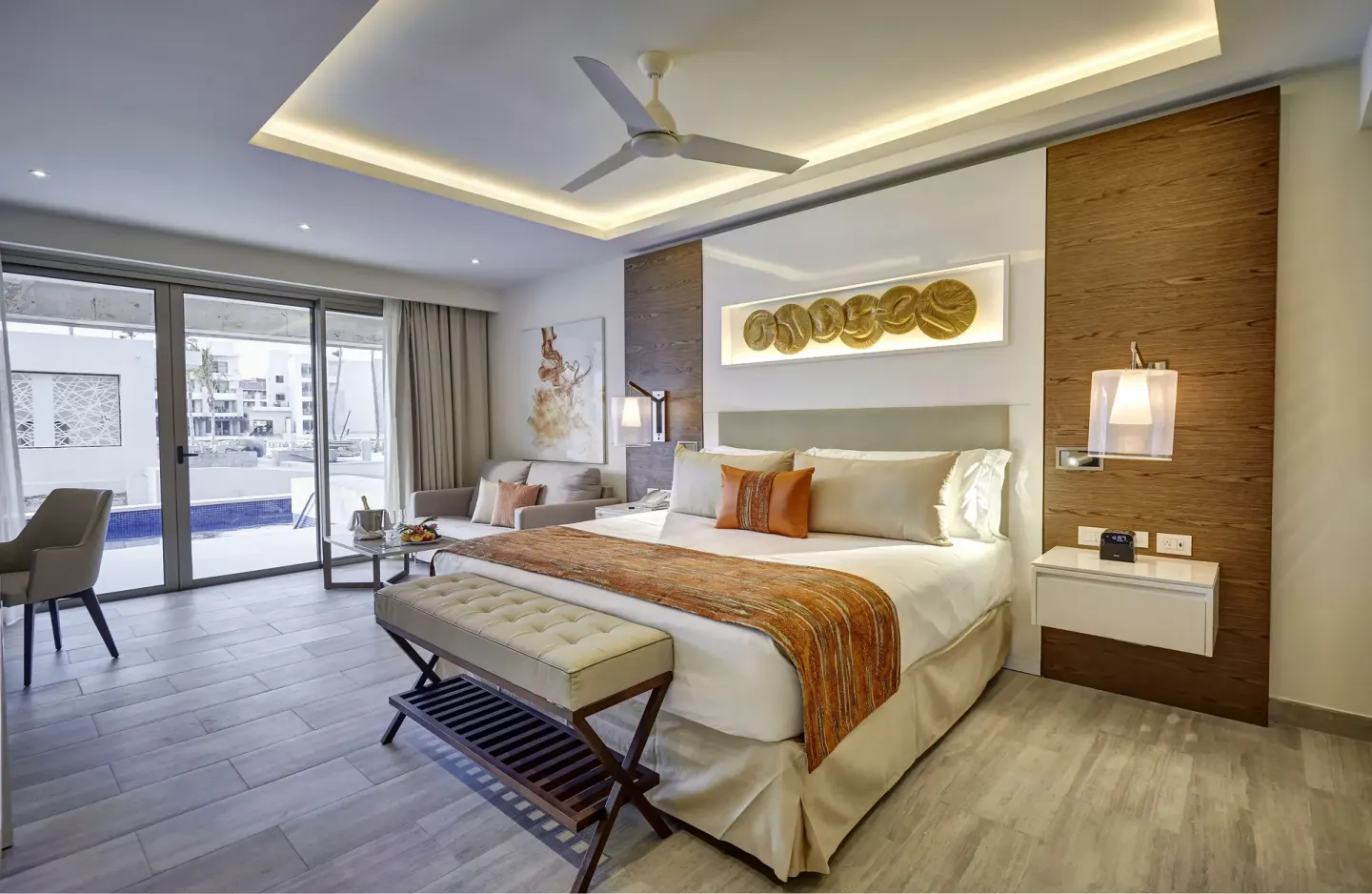 Luxury Junior Suite Swim Out with king bed and terrace doors at Royalton Bavaro Resort & Casino.
