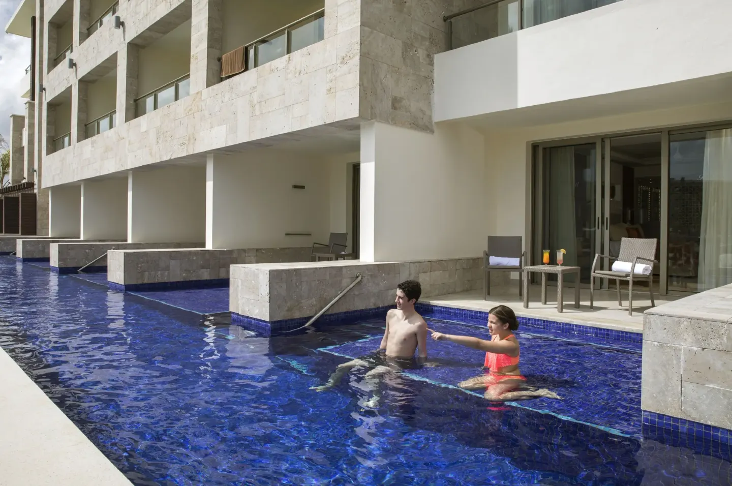 Swim-out patio and pool outside a Luxury Junior Suite at Royalton Bavaro Resort & Casino.