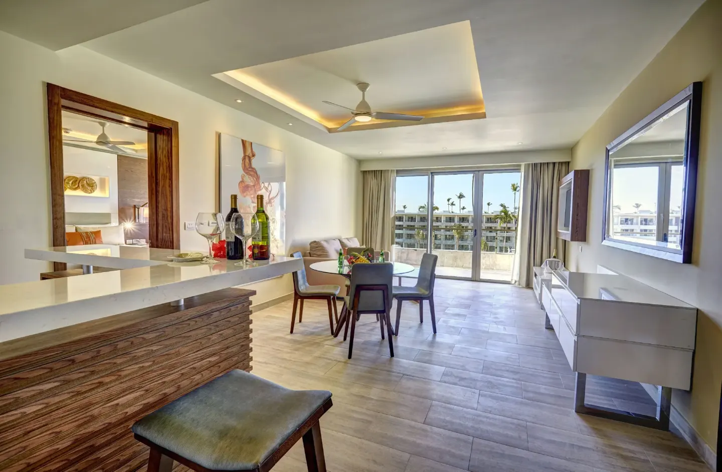 Luxury Presidential One Bedroom Suite living room with balcony at Royalton Bavaro Resort & Casino.