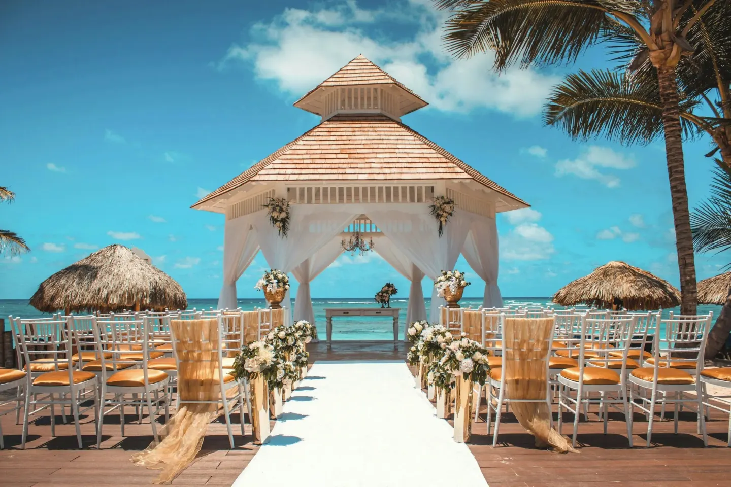 Beach wedding gazebo with aisle seating at Royalton Bavaro Resort & Casino.