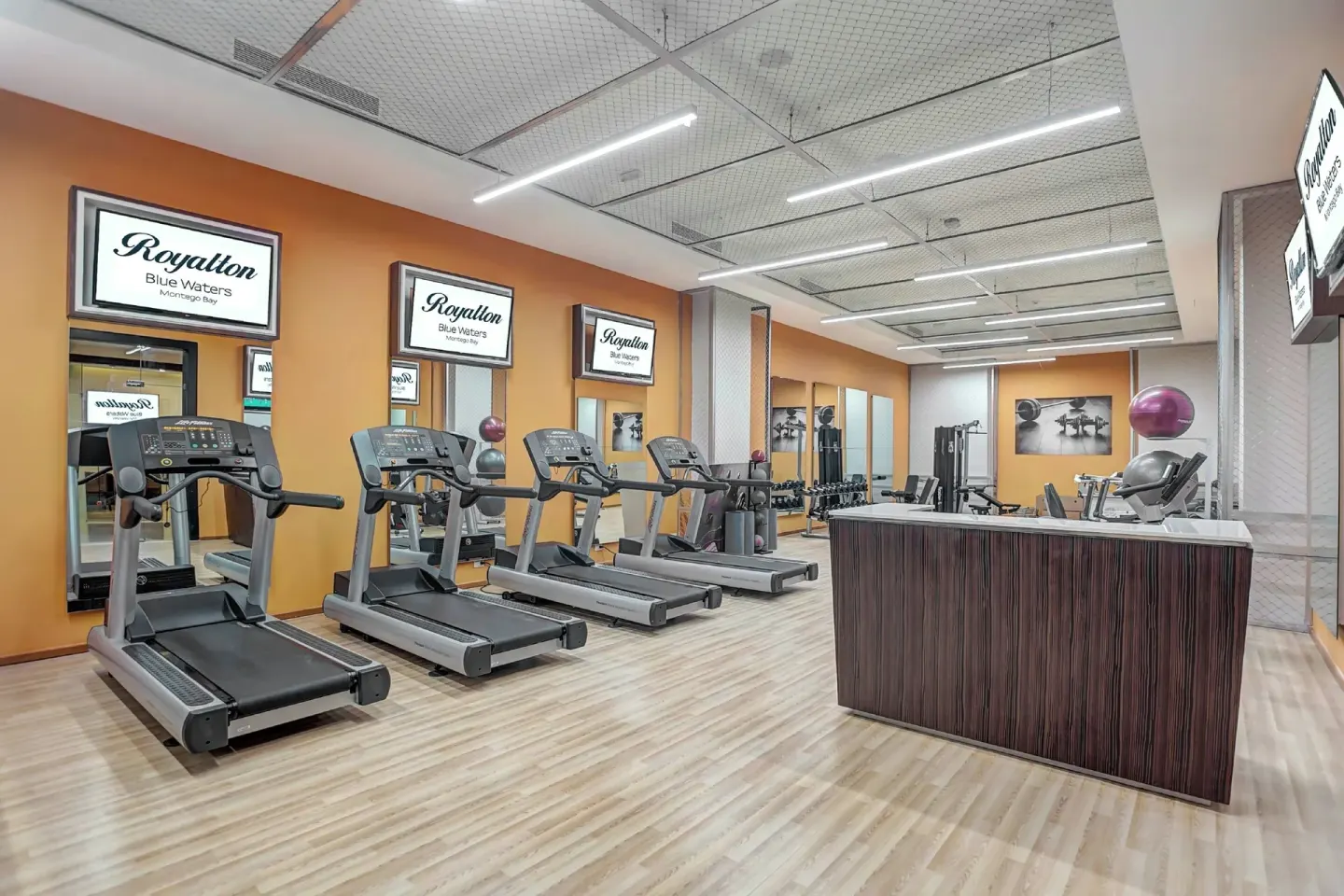Fitness center treadmills and front counter at Royalton Blue Waters Montego Bay.