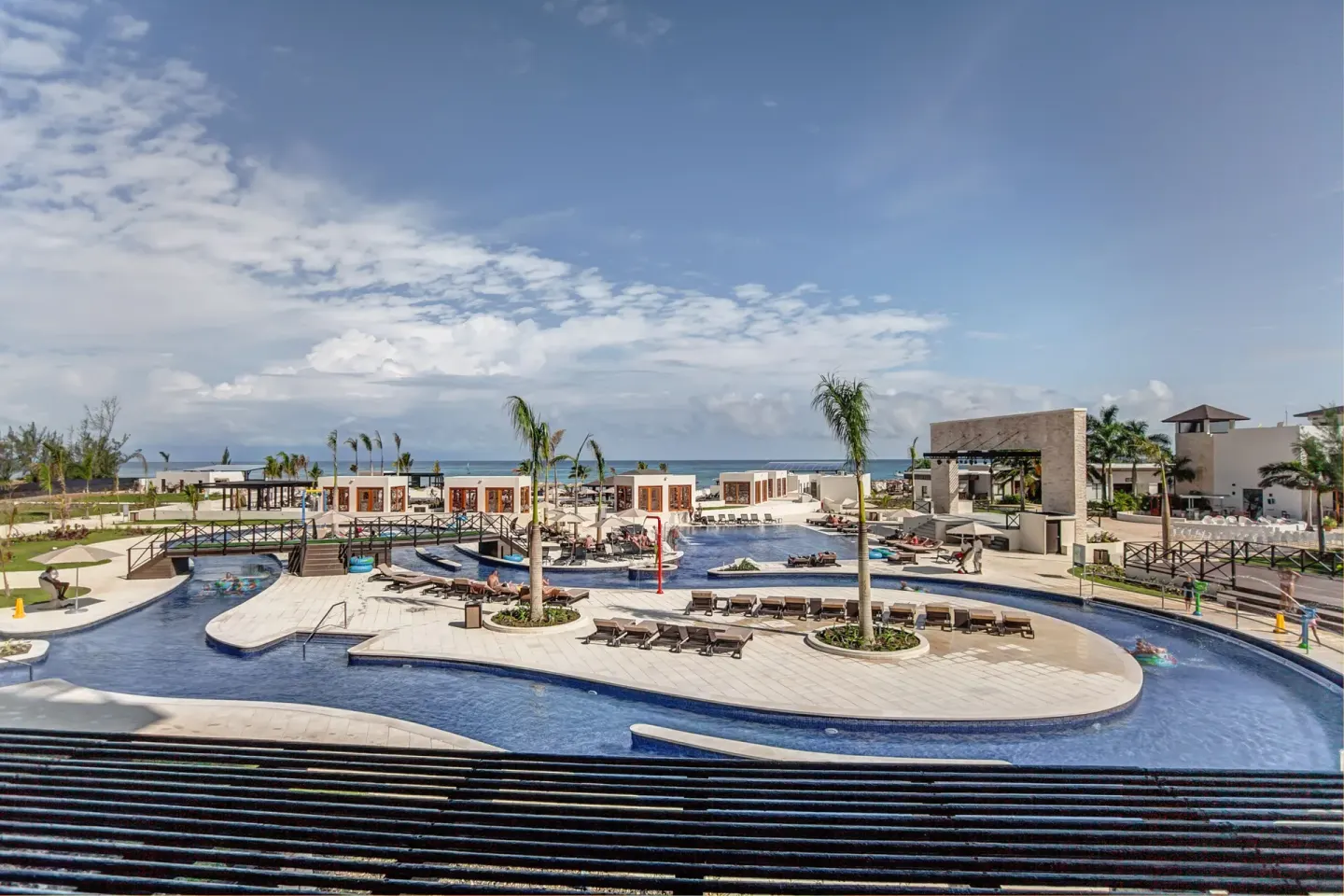 Wide view of the lazy river and pool deck at Royalton Blue Waters Montego Bay.
