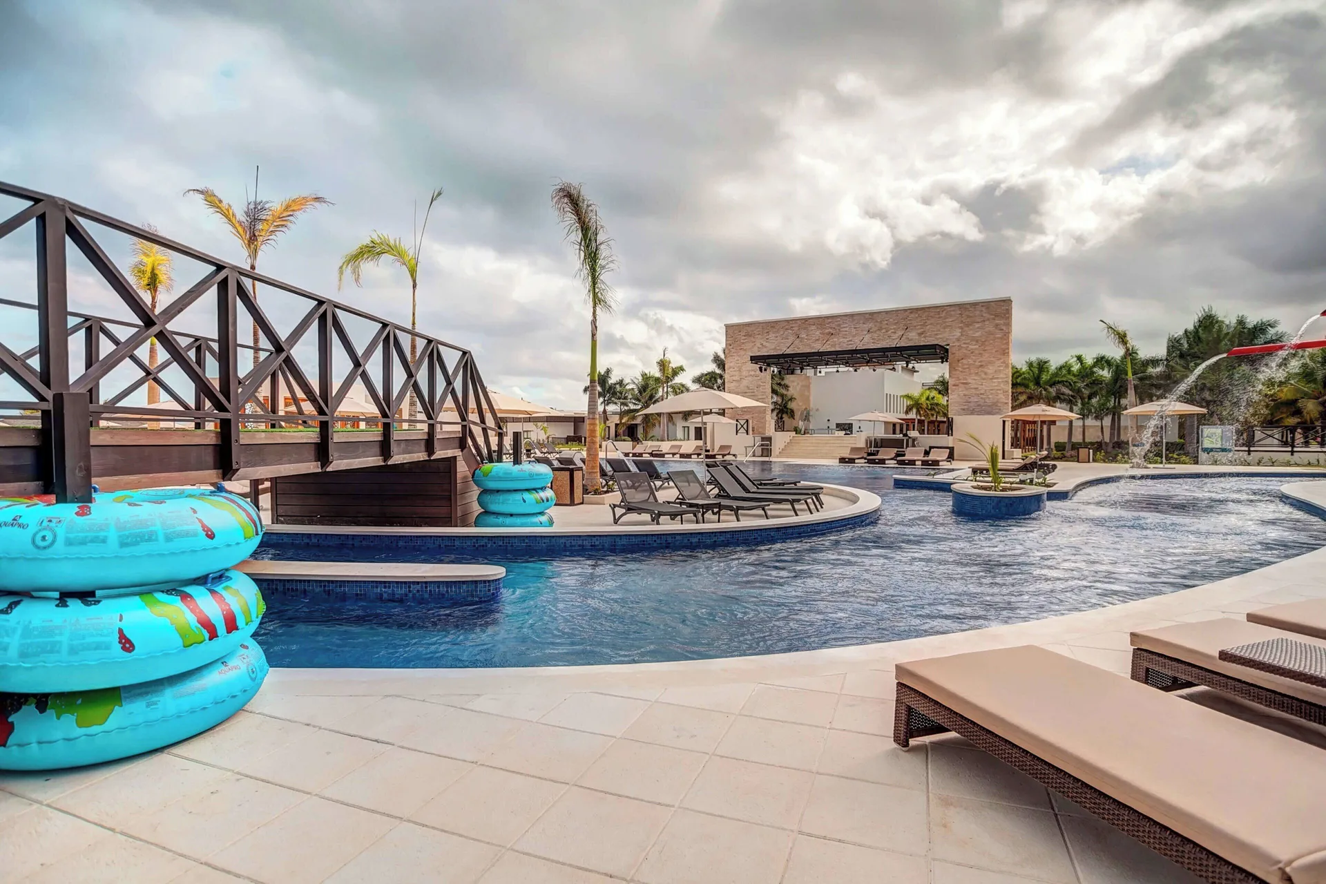 Lazy river pool with inner tubes and loungers at Royalton Blue Waters Montego Bay.