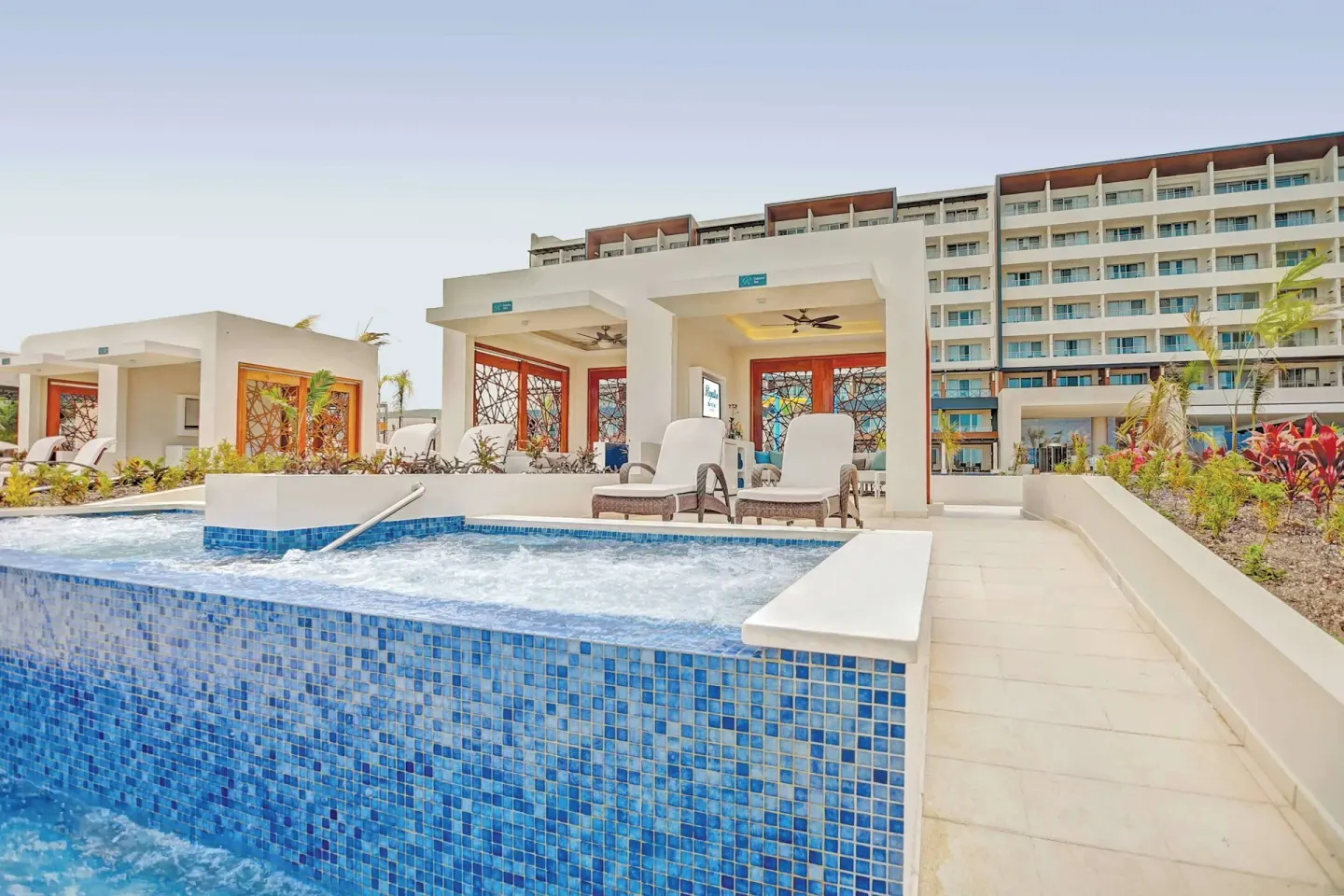 Private plunge pool terrace beside cabanas at Royalton Blue Waters Montego Bay.