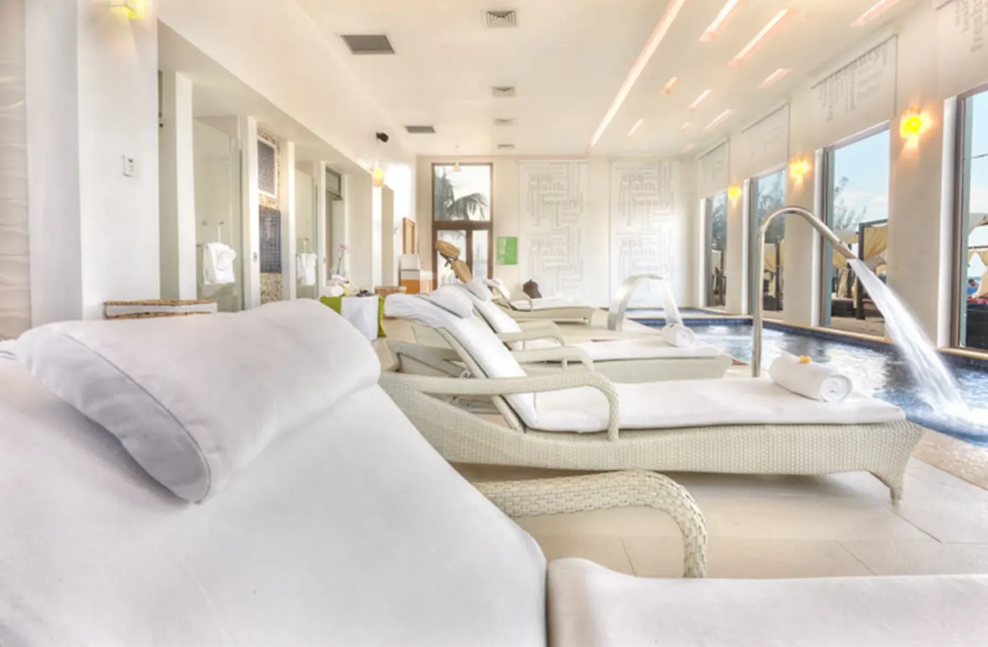 Spa relaxation loungers and an indoor pool at Royalton Blue Waters Montego Bay.