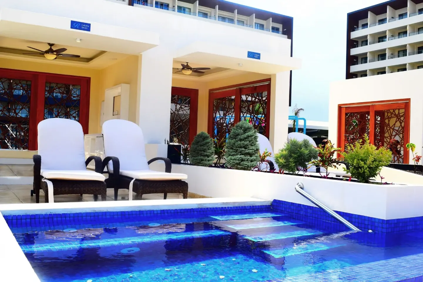 A swim-out terrace with loungers and a private pool at Royalton Blue Waters Montego Bay.