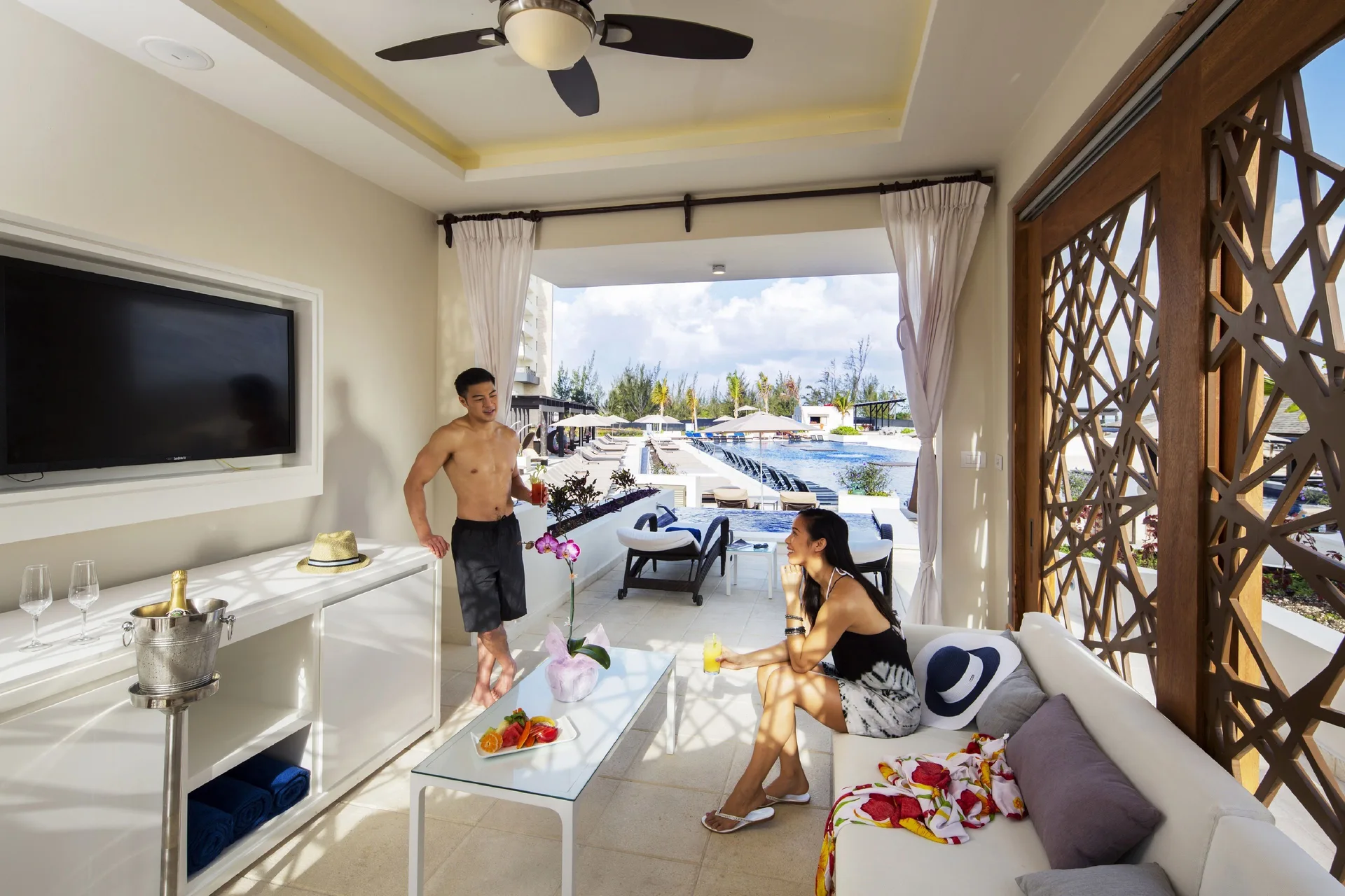 Covered swim-up suite patio facing the pool at Royalton Blue Waters Montego Bay.