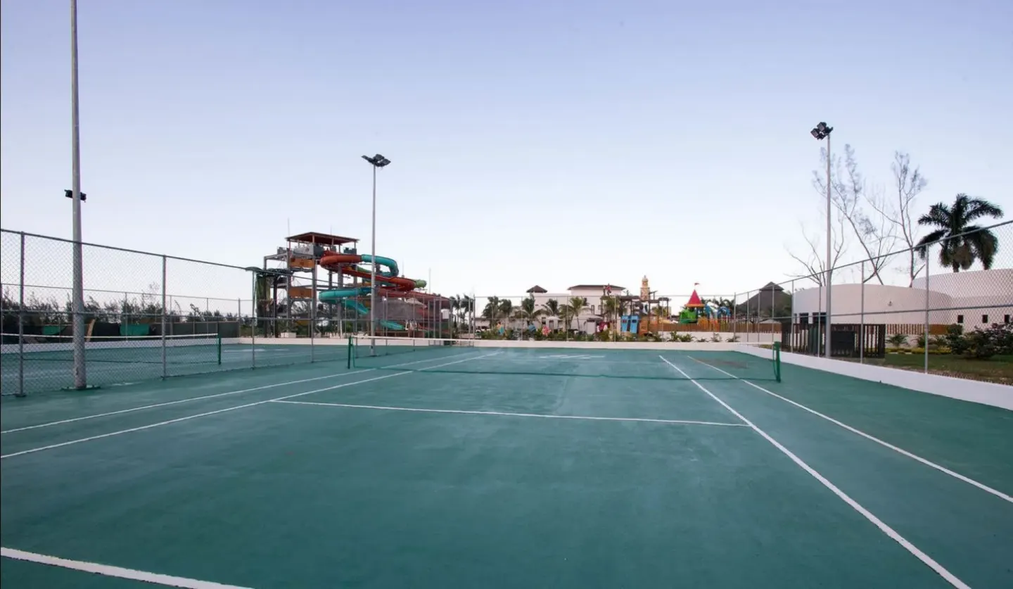 Tennis court near water slides at Royalton Blue Waters Montego Bay.