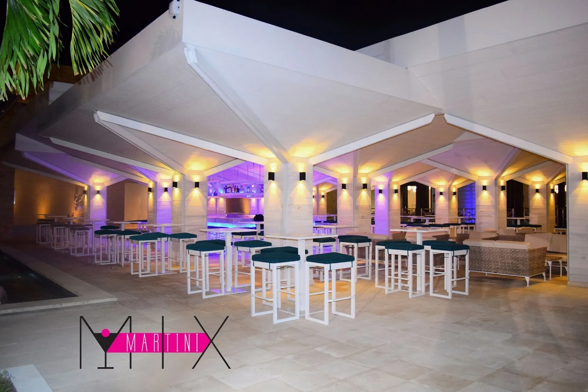 Martini Mix open-air bar terrace with high stools at Royalton Blue Waters Montego Bay.