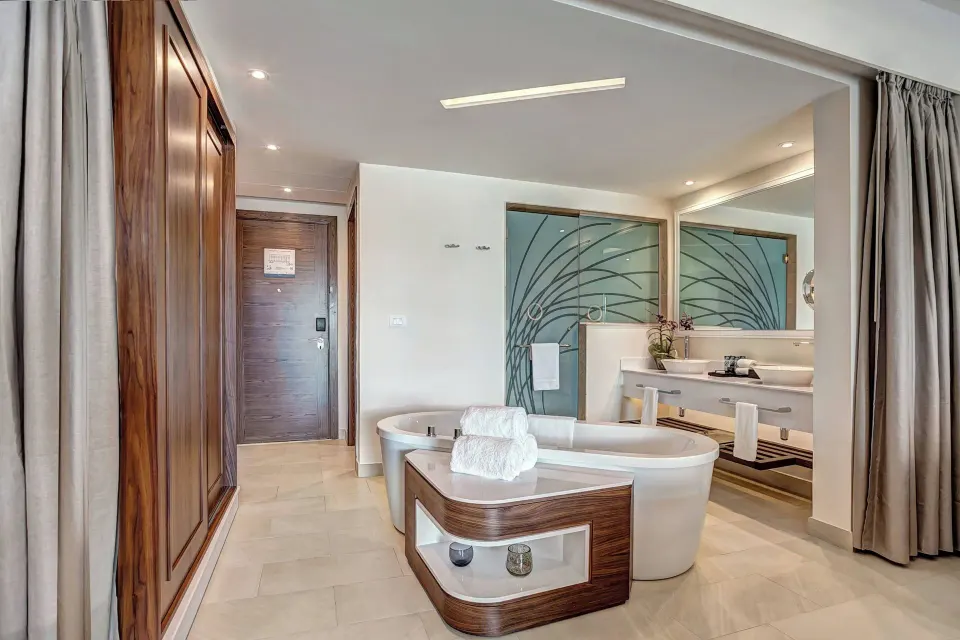 Luxury Junior Suite Swim Out bathroom with soaking tub at Royalton Blue Waters Montego Bay.