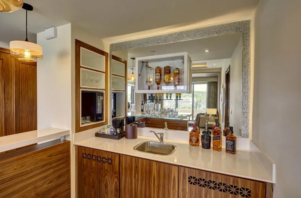 Suite wet bar with sink and glassware at Royalton Blue Waters Montego Bay.
