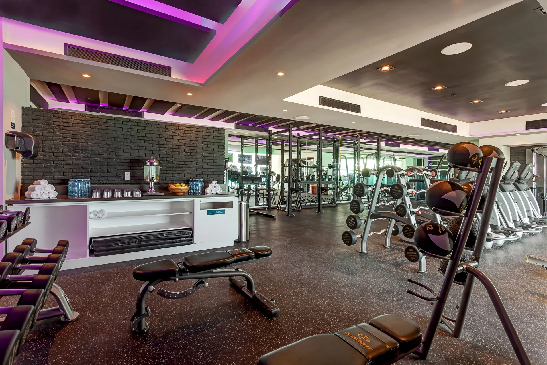 Weights and cardio equipment fill the fitness center at Royalton CHIC Cancun.