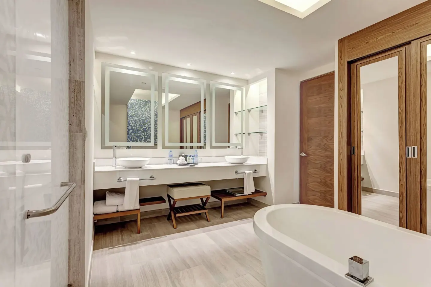 Bathroom with freestanding tub and double vanity at Royalton CHIC Cancun.