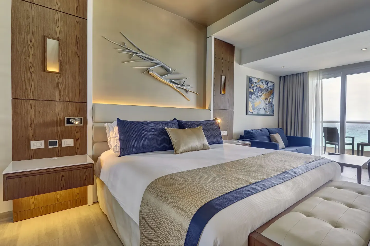 Guest room with king bed and balcony ocean view at Royalton CHIC Cancun.