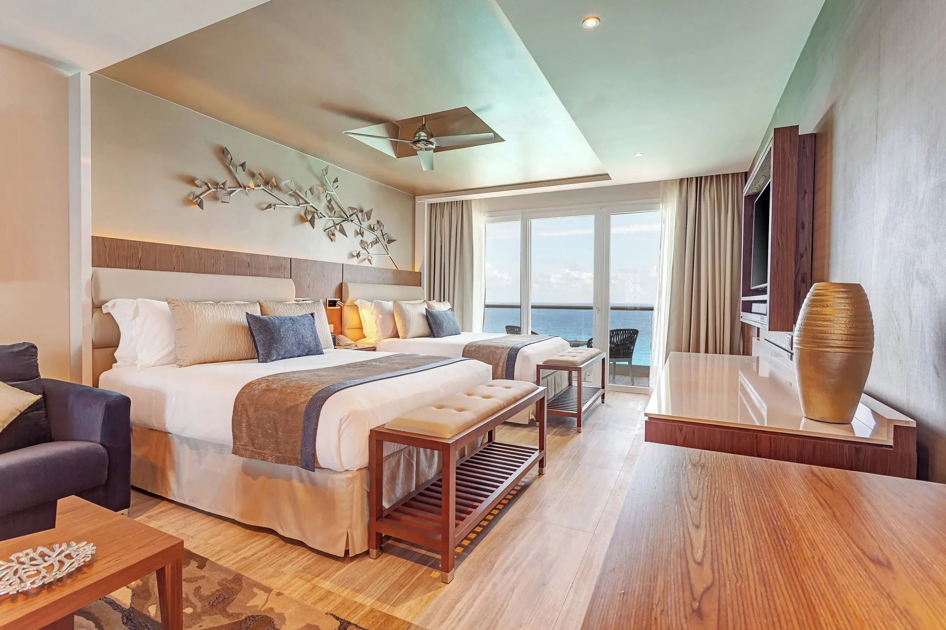 Double bed guest room with ocean-facing balcony at Royalton CHIC Cancun.