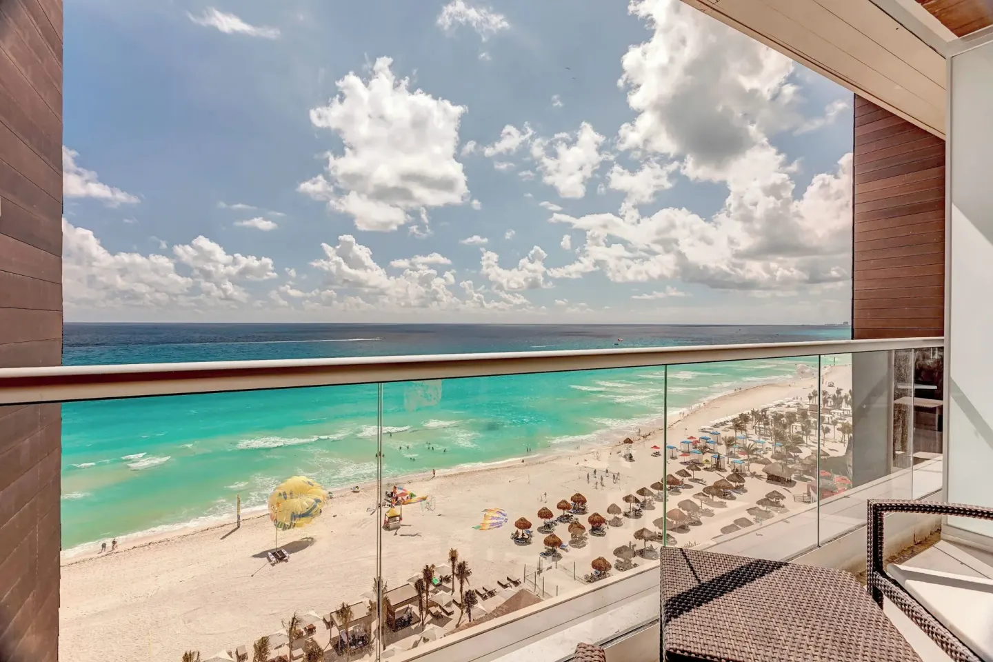 Balcony overlooking the beach and Caribbean Sea at Royalton CHIC Cancun.