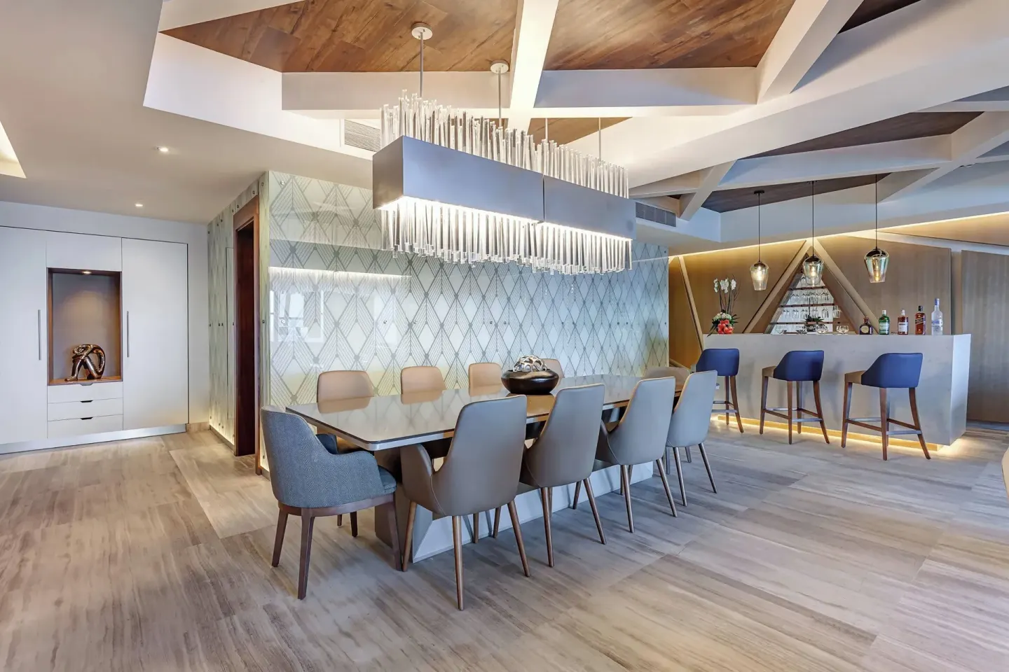 Large suite dining room with private bar at Royalton CHIC Cancun.