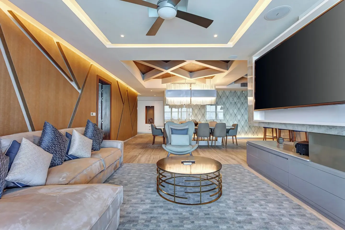 Suite living and dining area with sectional sofa at Royalton CHIC Cancun.