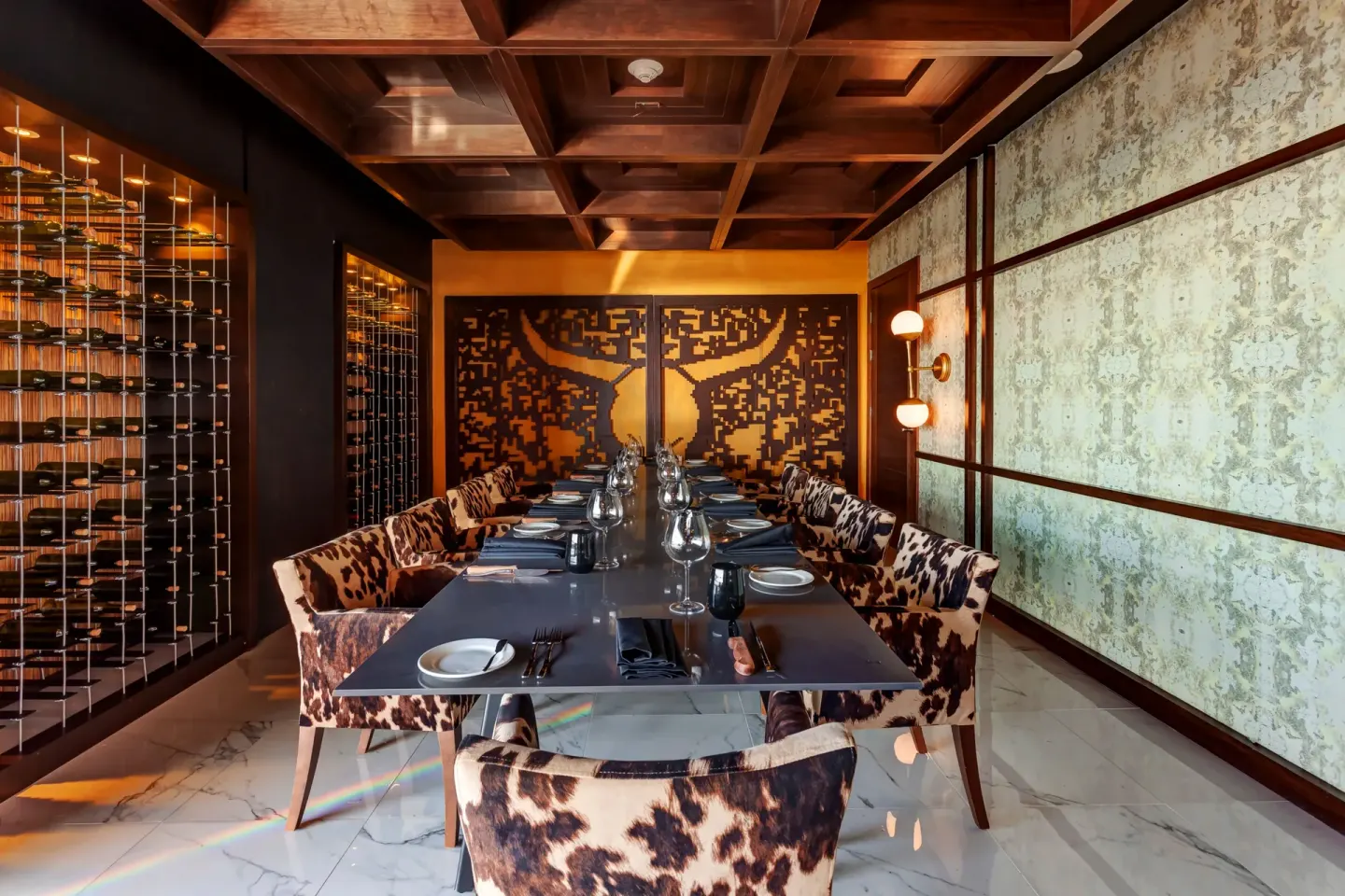 Private steakhouse-style dining room with wine racks at Royalton CHIC Cancun.